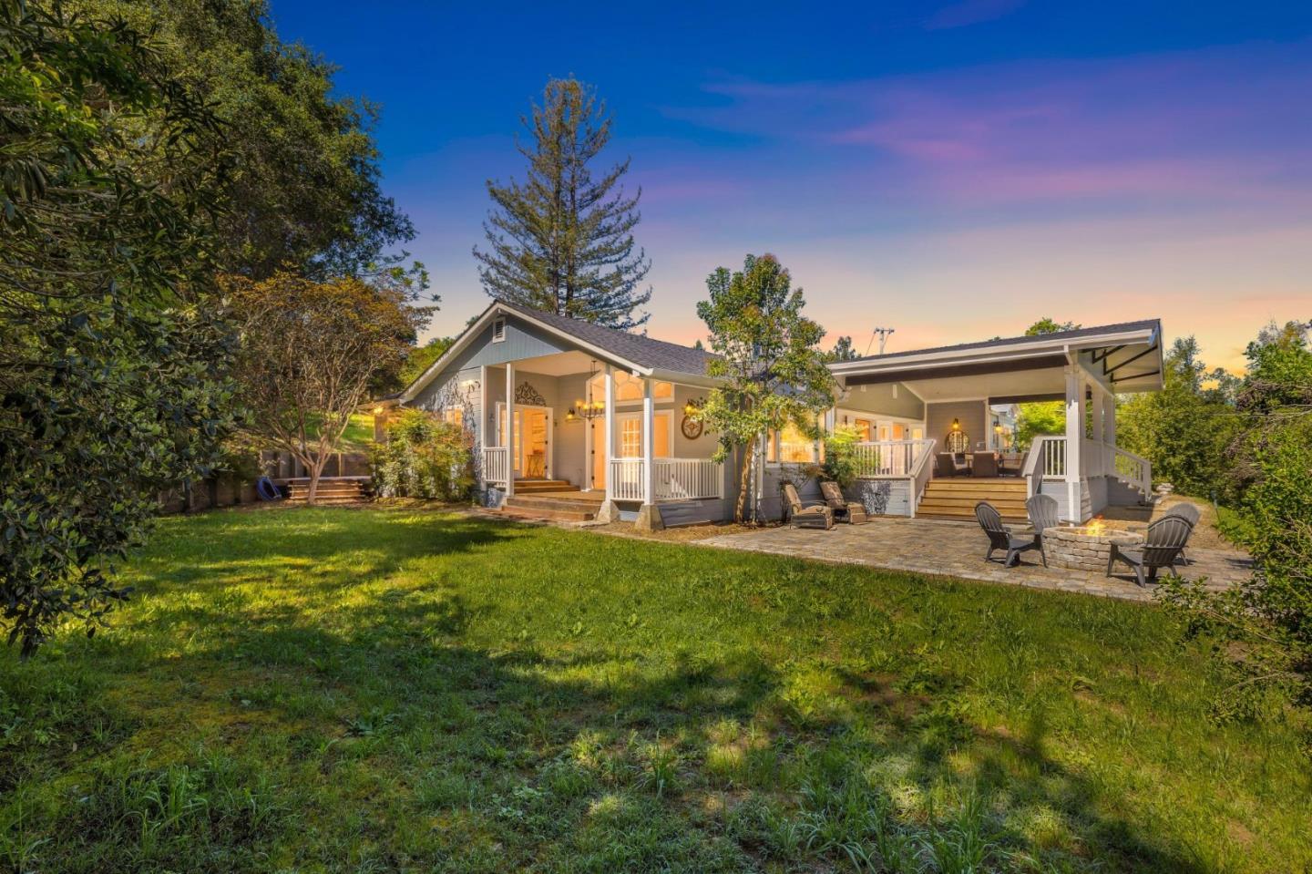 a front view of house with yard and outdoor seating