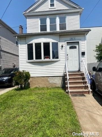 a front view of a house with a yard