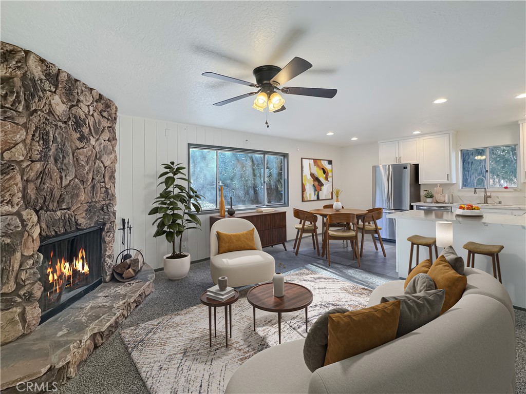 a living room with furniture and a fireplace