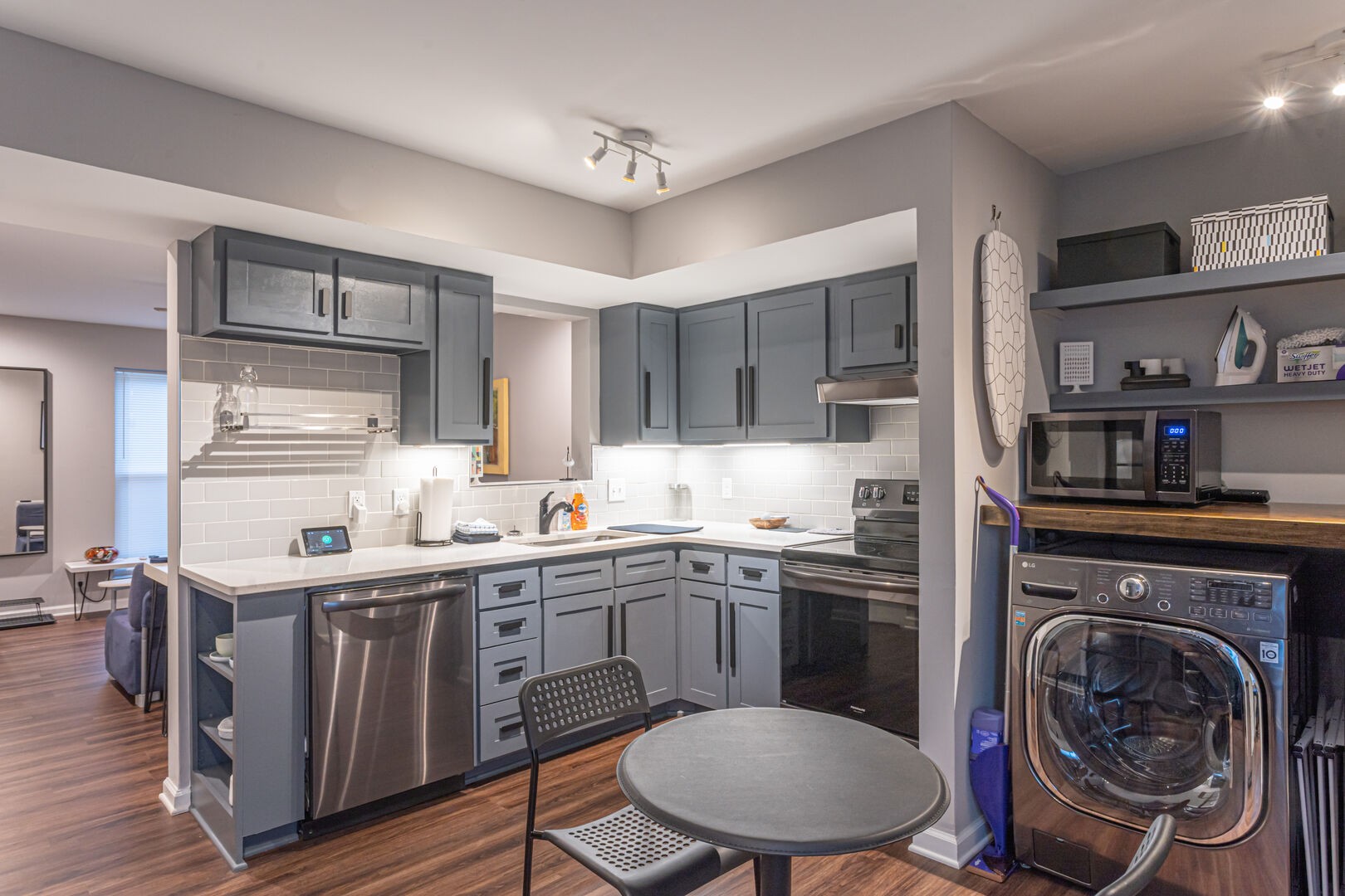 a kitchen with a sink a stove and cabinets