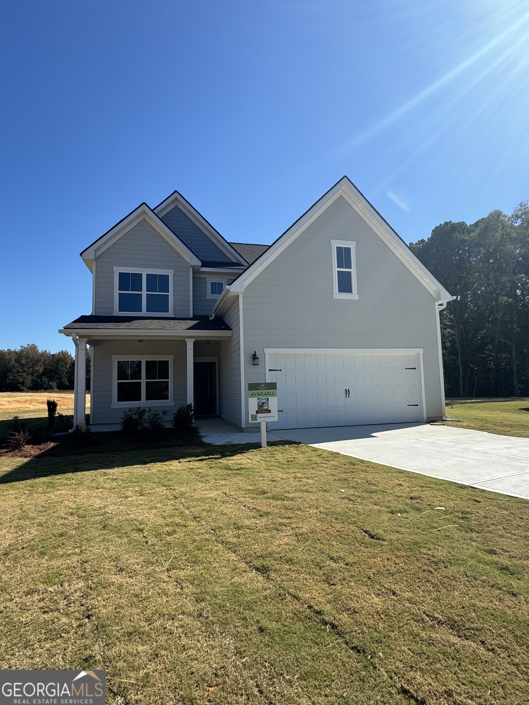 a front view of a house with yard