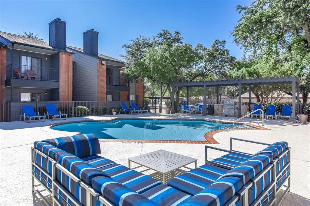 a view of a patio with swimming pool