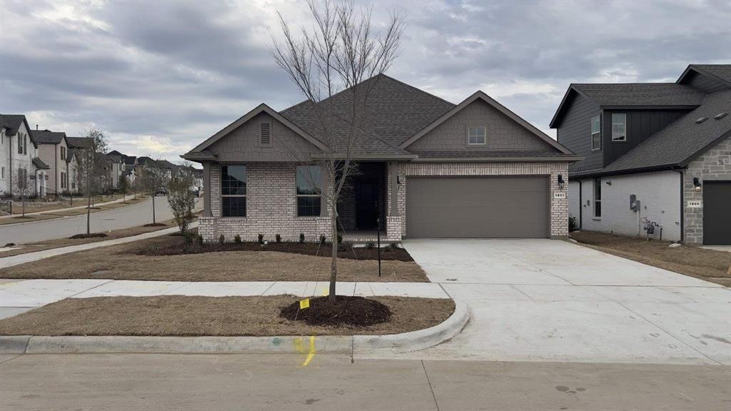 a front view of a house with garage