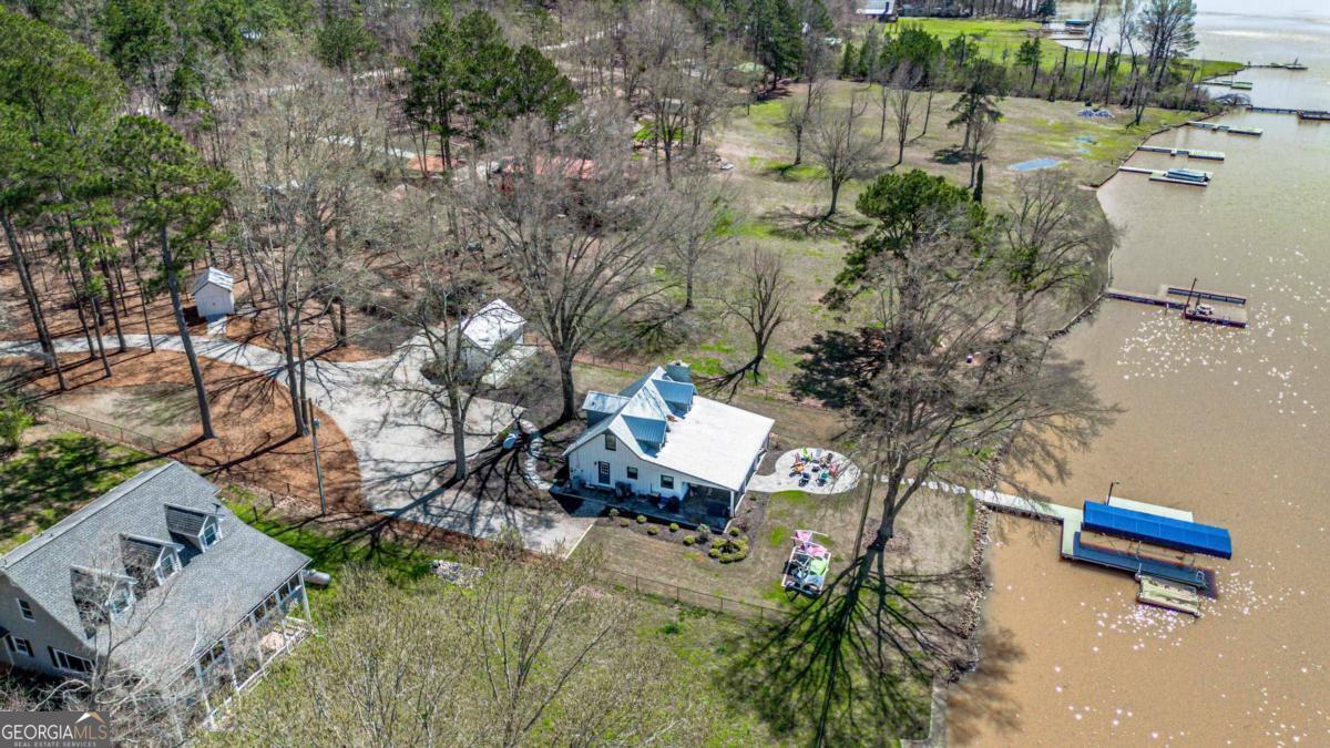 an aerial view of a house with outdoor space