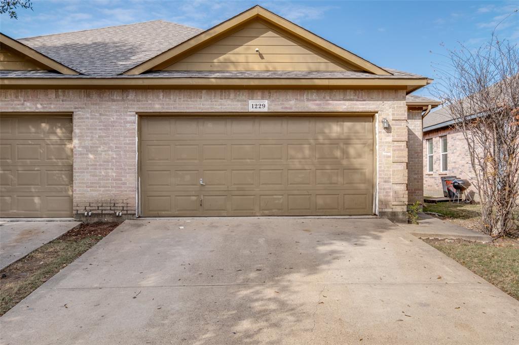 a front view of a house with a garage