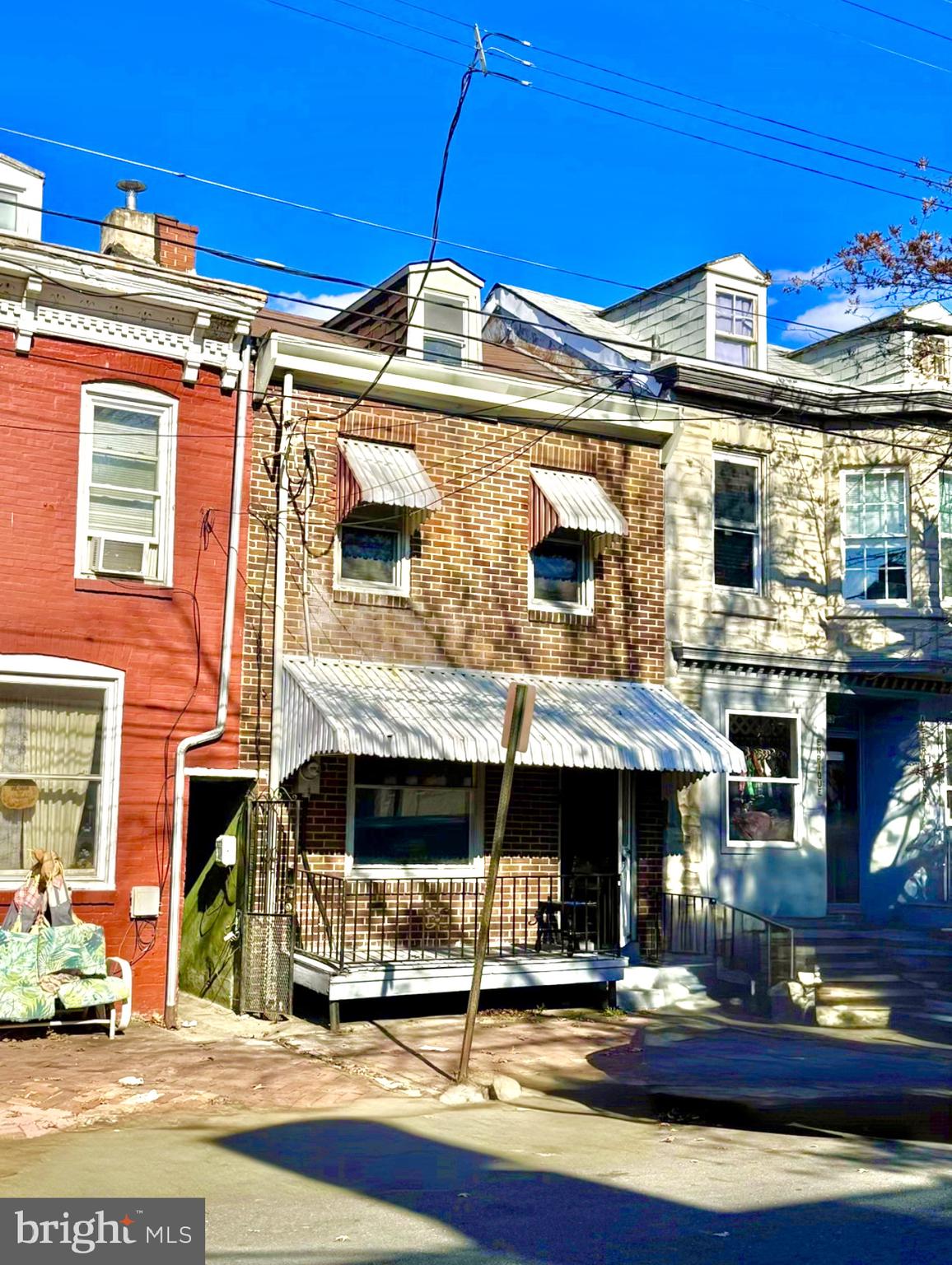 a front view of a building with street view