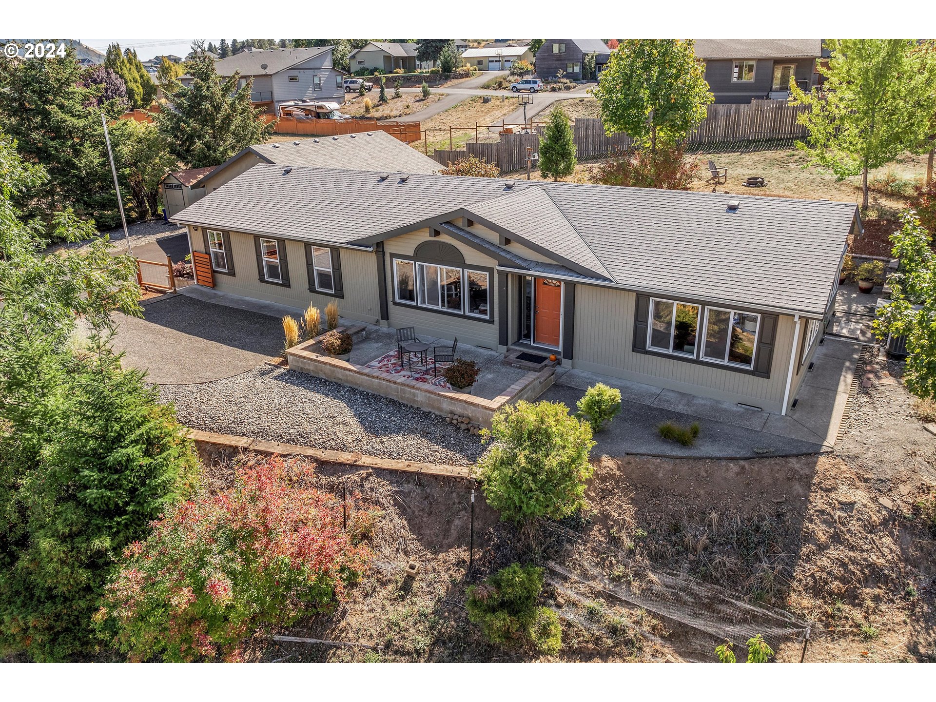 an aerial view of a house with a big yard