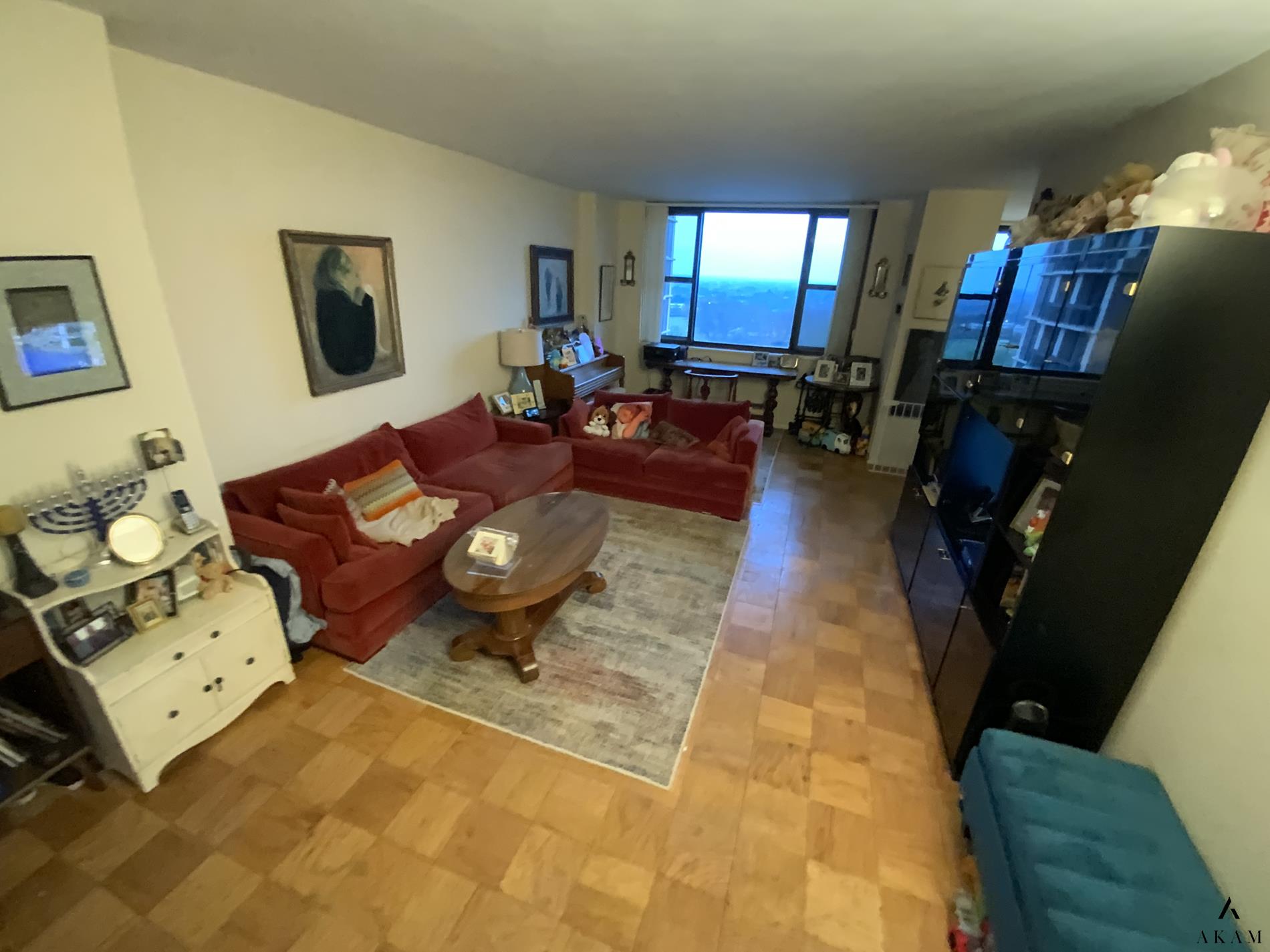 a living room with furniture and a flat screen tv