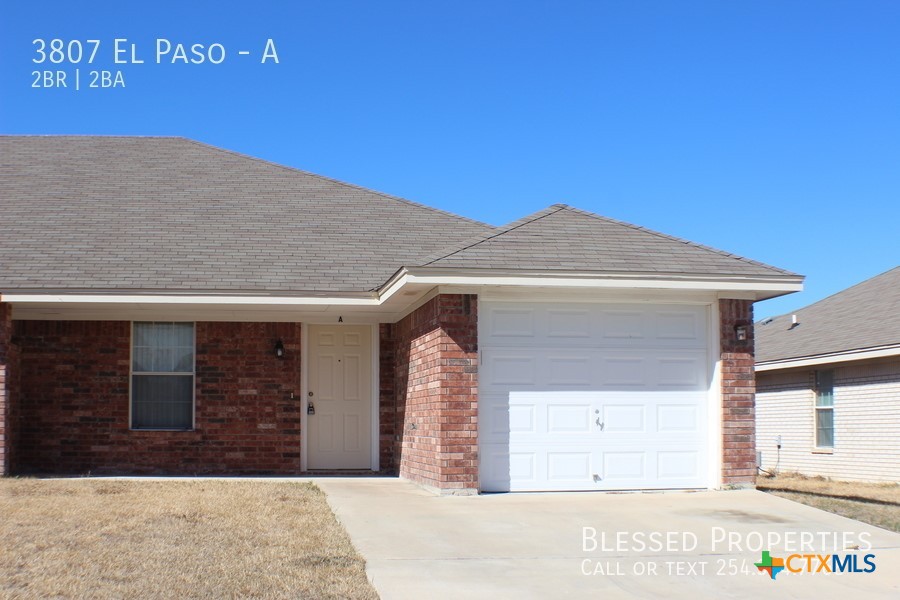 a front view of a house with a garage