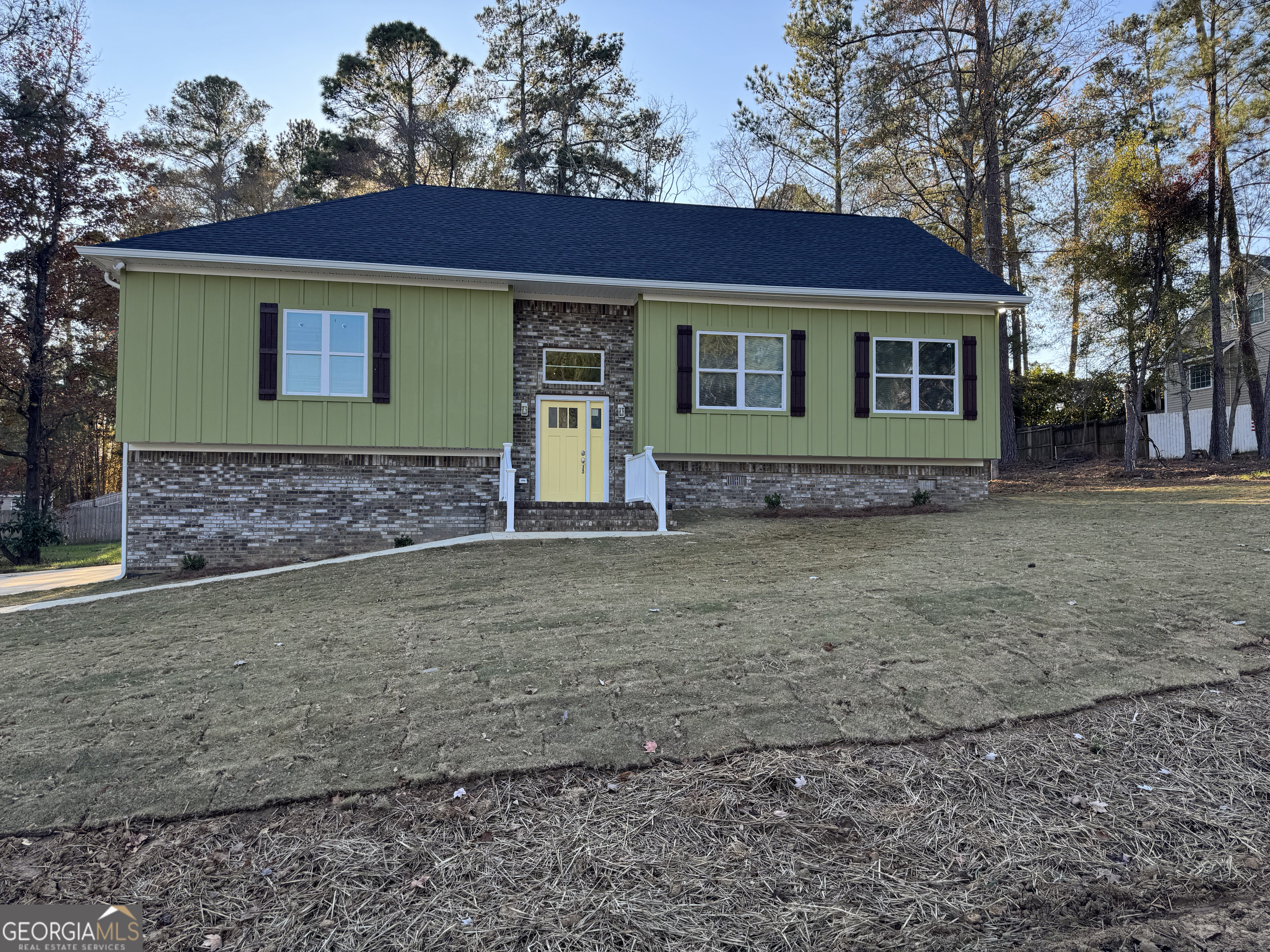 a front view of a house with garden