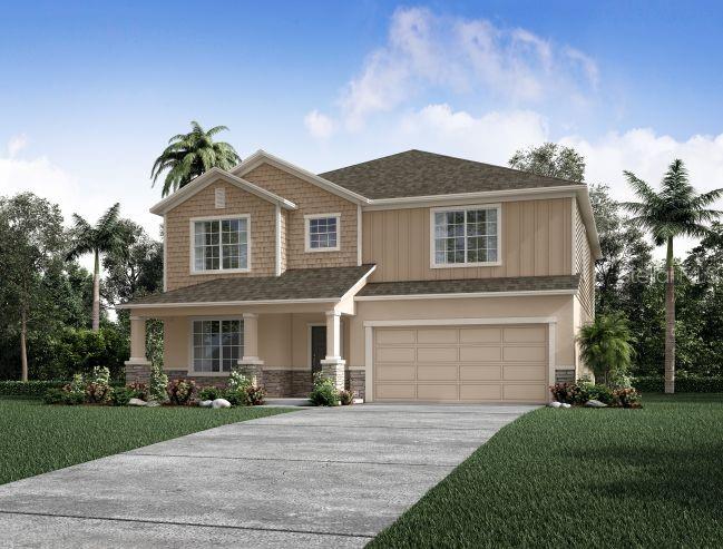 a front view of a house with a yard and a garage