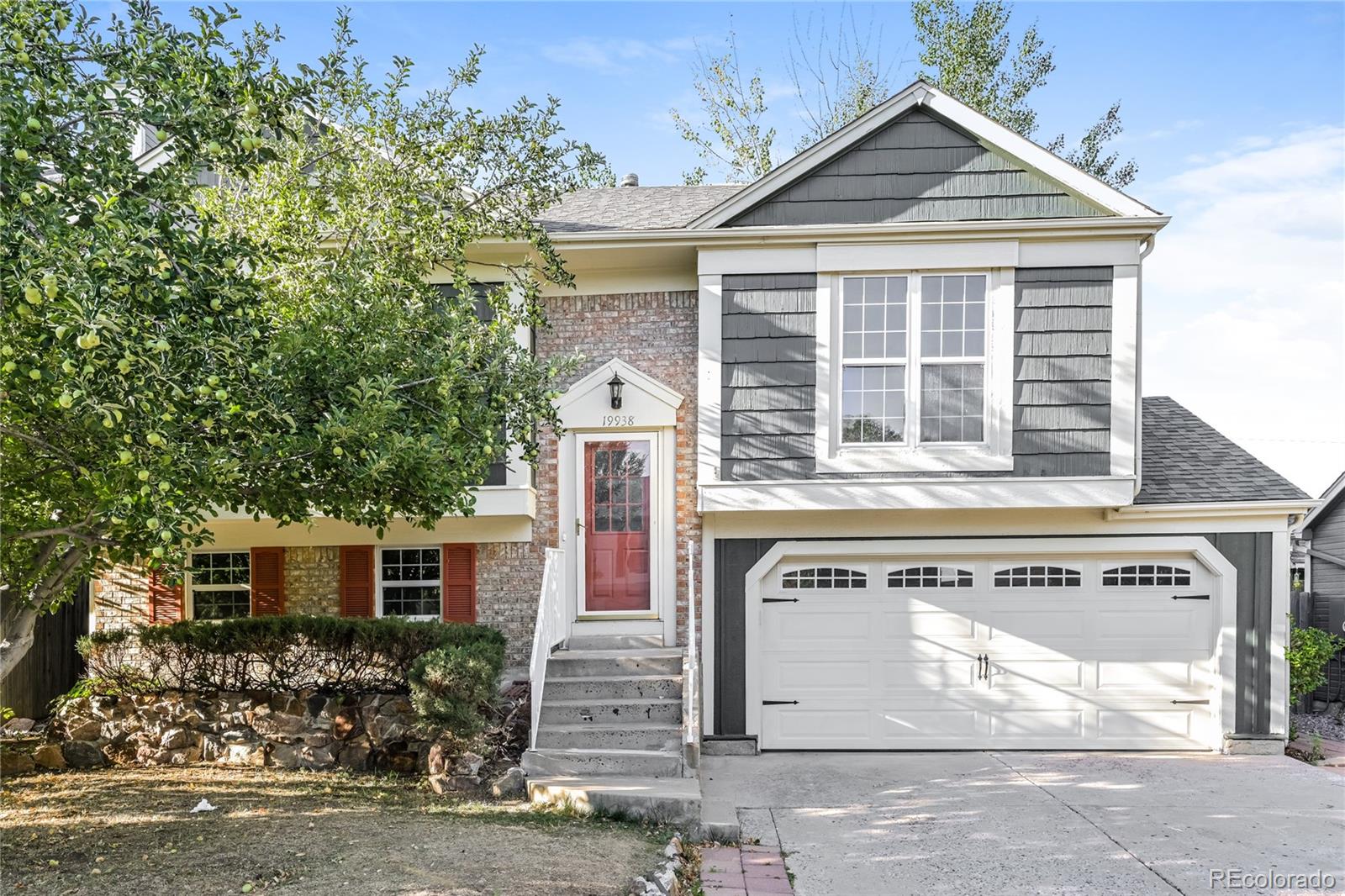 a front view of a house with a garage