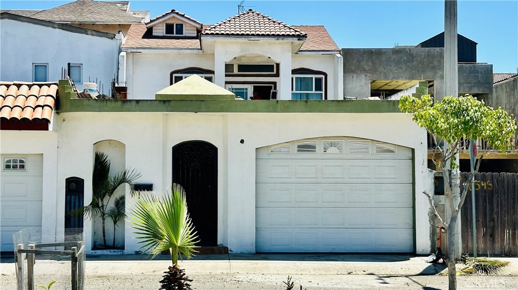 a front view of a house with parking