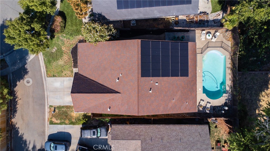 an aerial view of a house with a yard