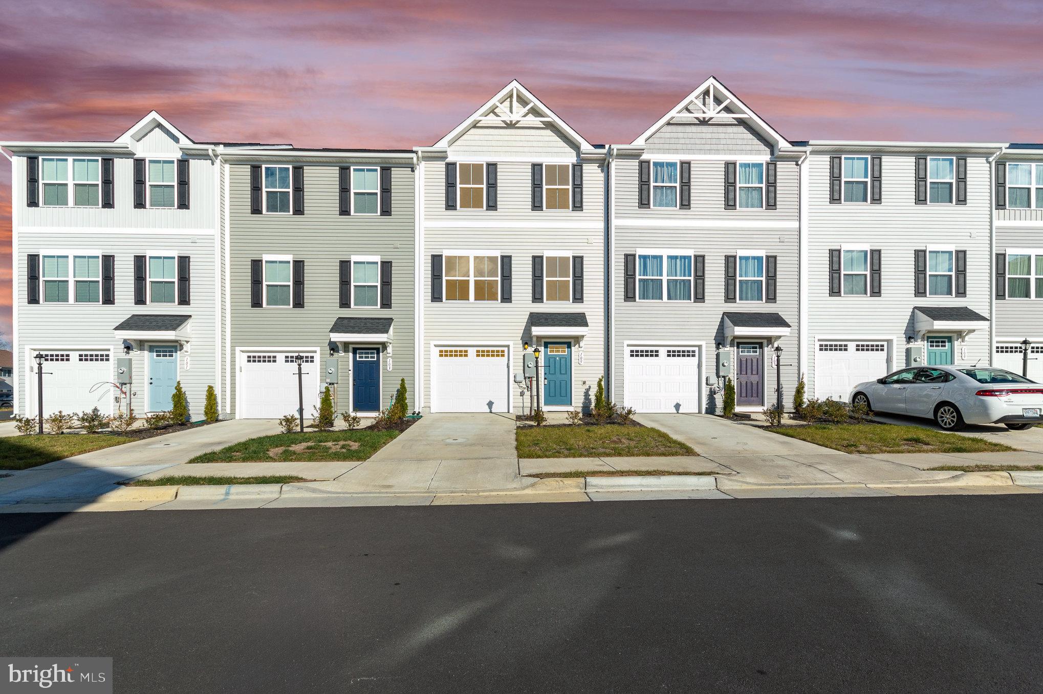 a view of multiple houses with a street