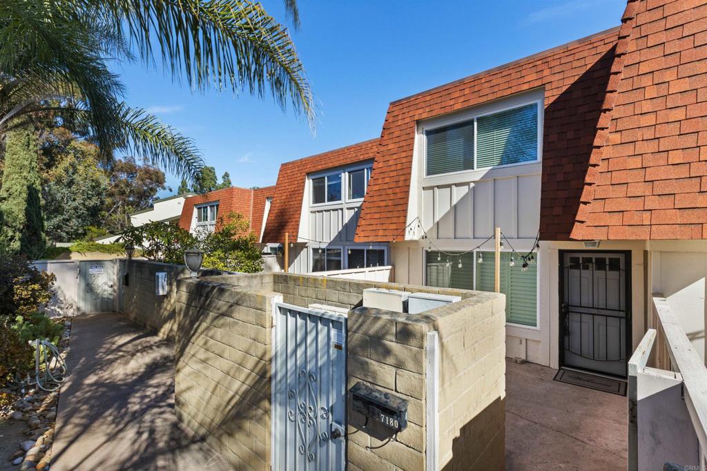 a view of a house with balcony and outdoor space