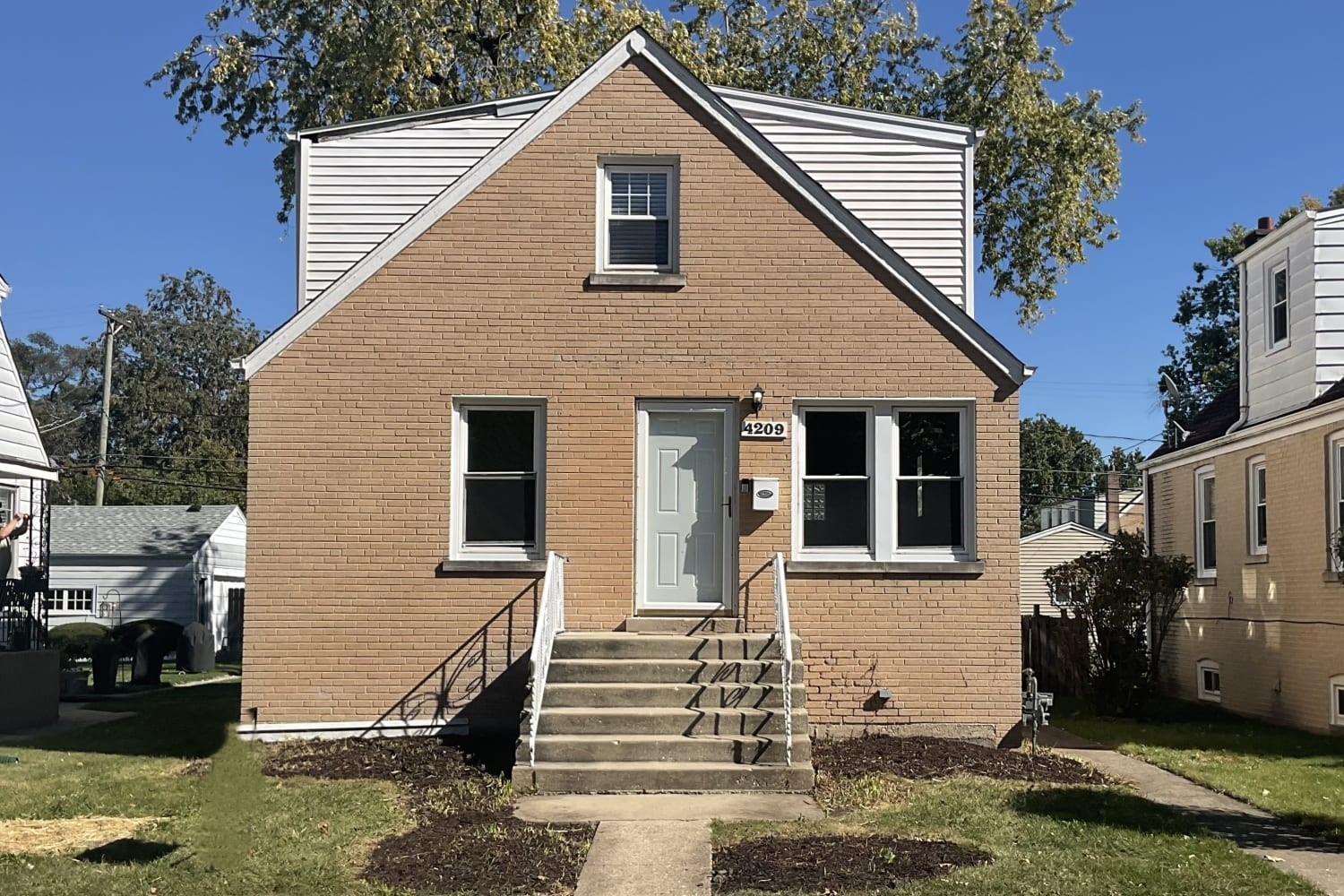 a front view of a house with a garage