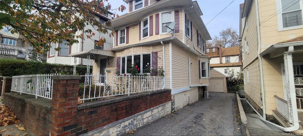 View of side of property featuring a porch