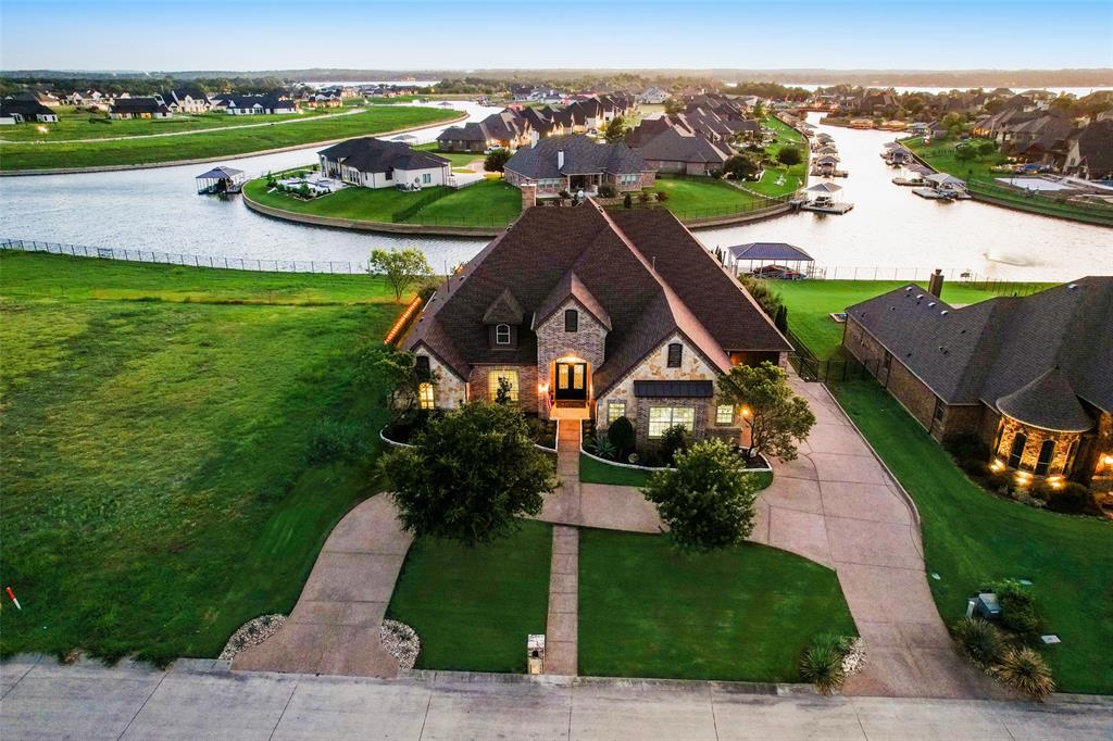 an aerial view of a house with a garden and trees all around