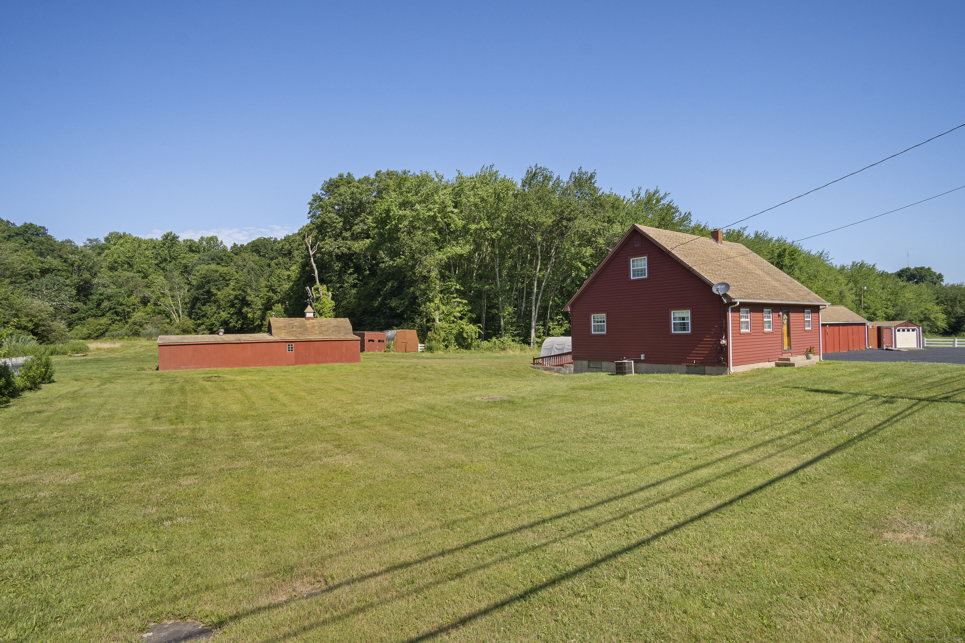 a view of an house with backyard space and garden