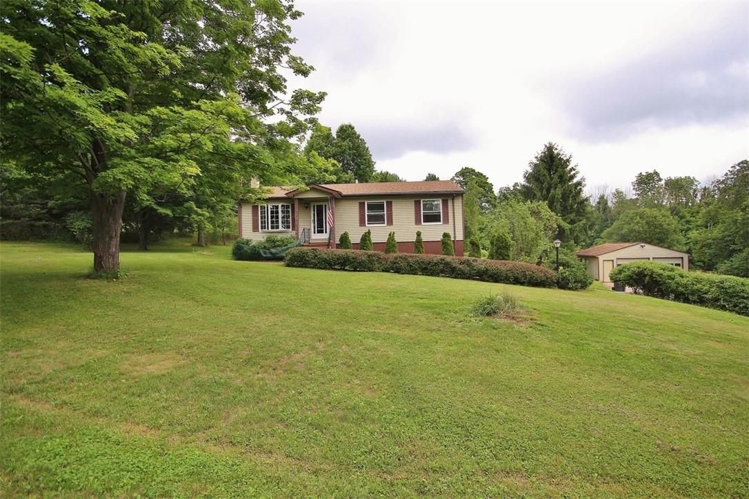 a view of a house with a big yard