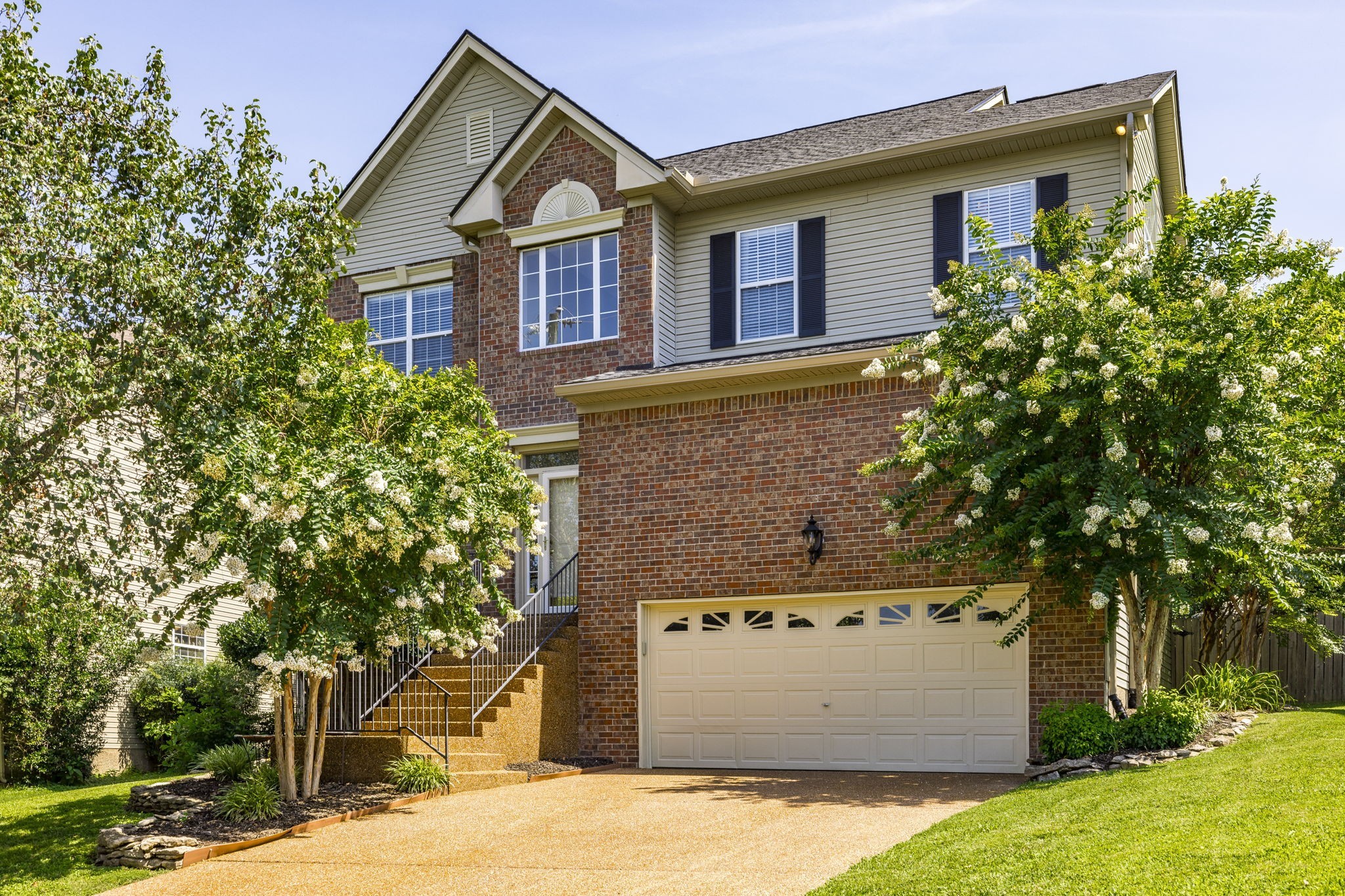 front view of a house with a yard