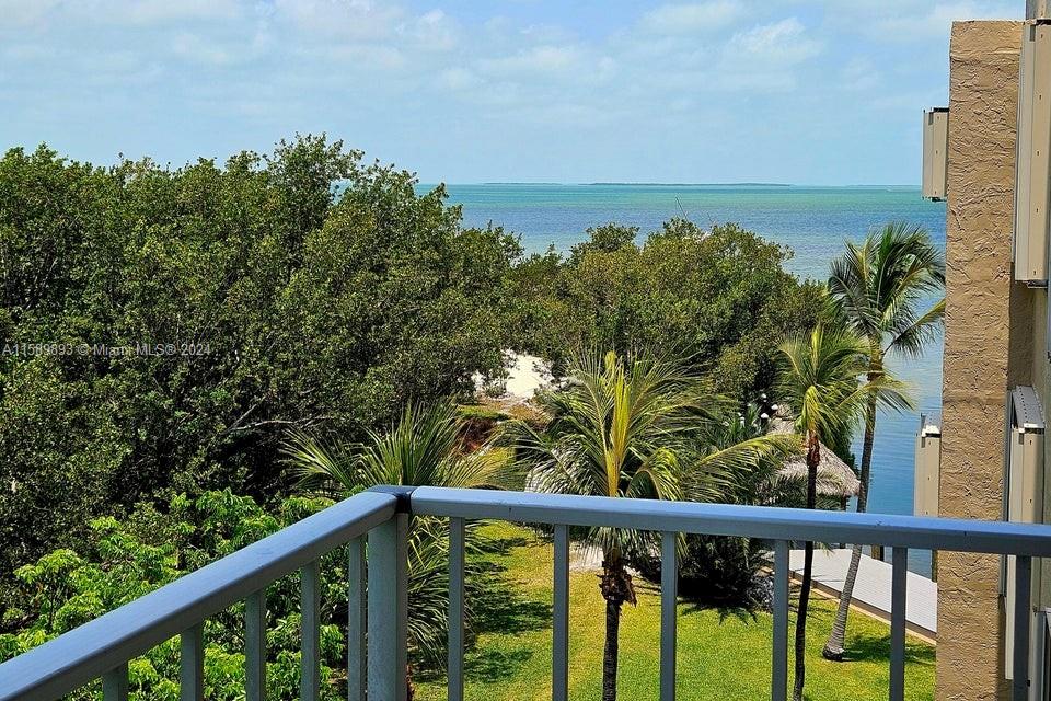 a view of a balcony with an outdoor space