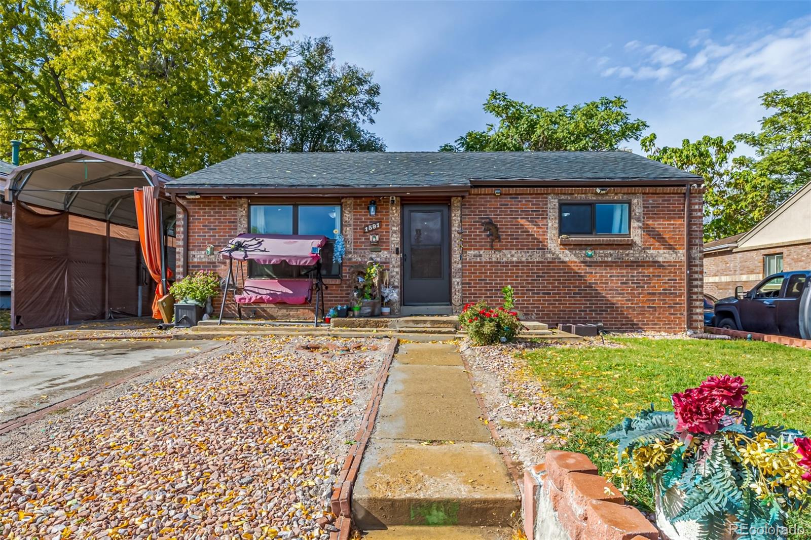 a front view of a house with yard