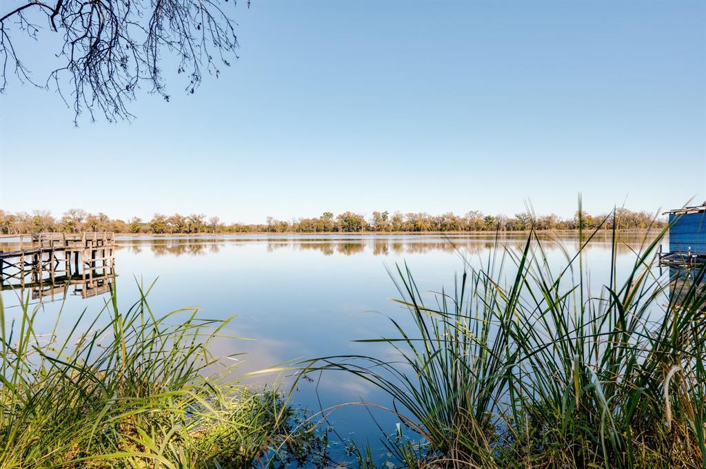 a view of a lake with sitting area