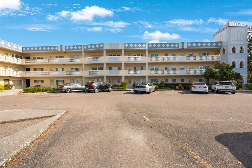 a building with cars parked in front of it