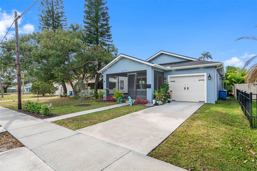 a front view of house with yard and green space