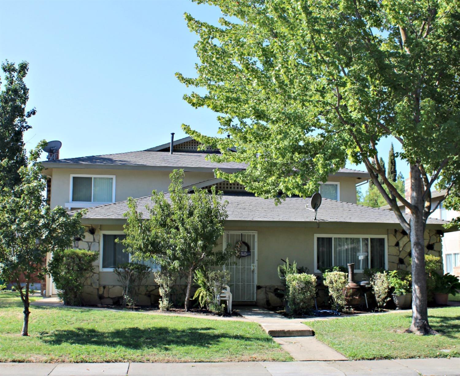 front view of a house with a yard