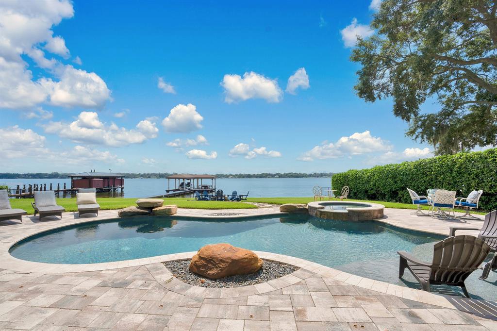 a view of a swimming pool and lounge chair