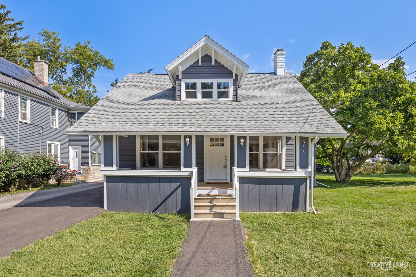 front view of a house with a yard