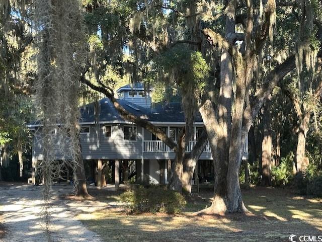 Rear view of house featuring a carport