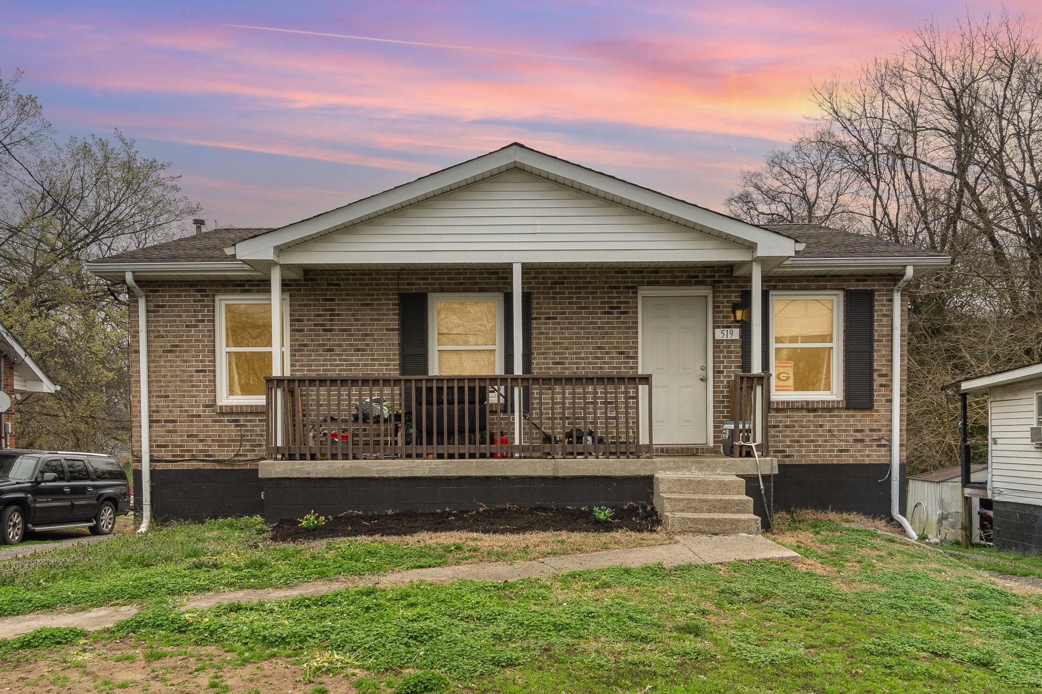 a front view of a house with a yard