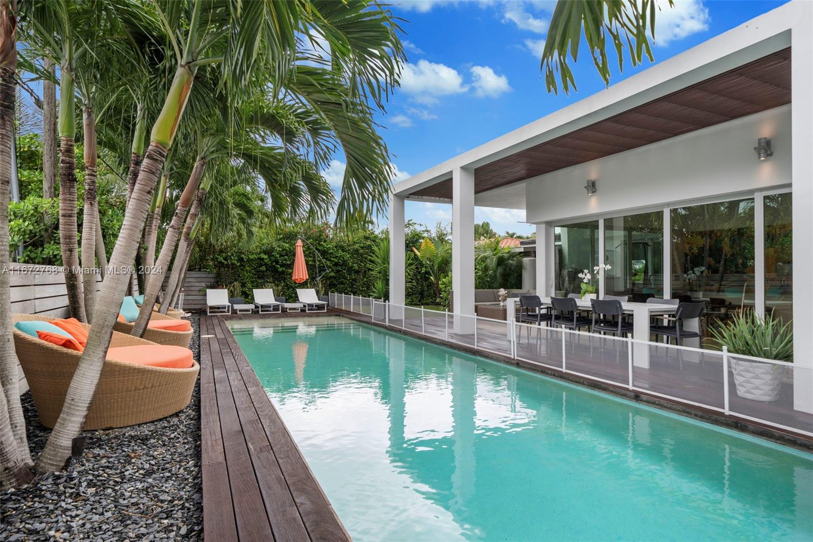 swimming pool with outdoor seating and yard