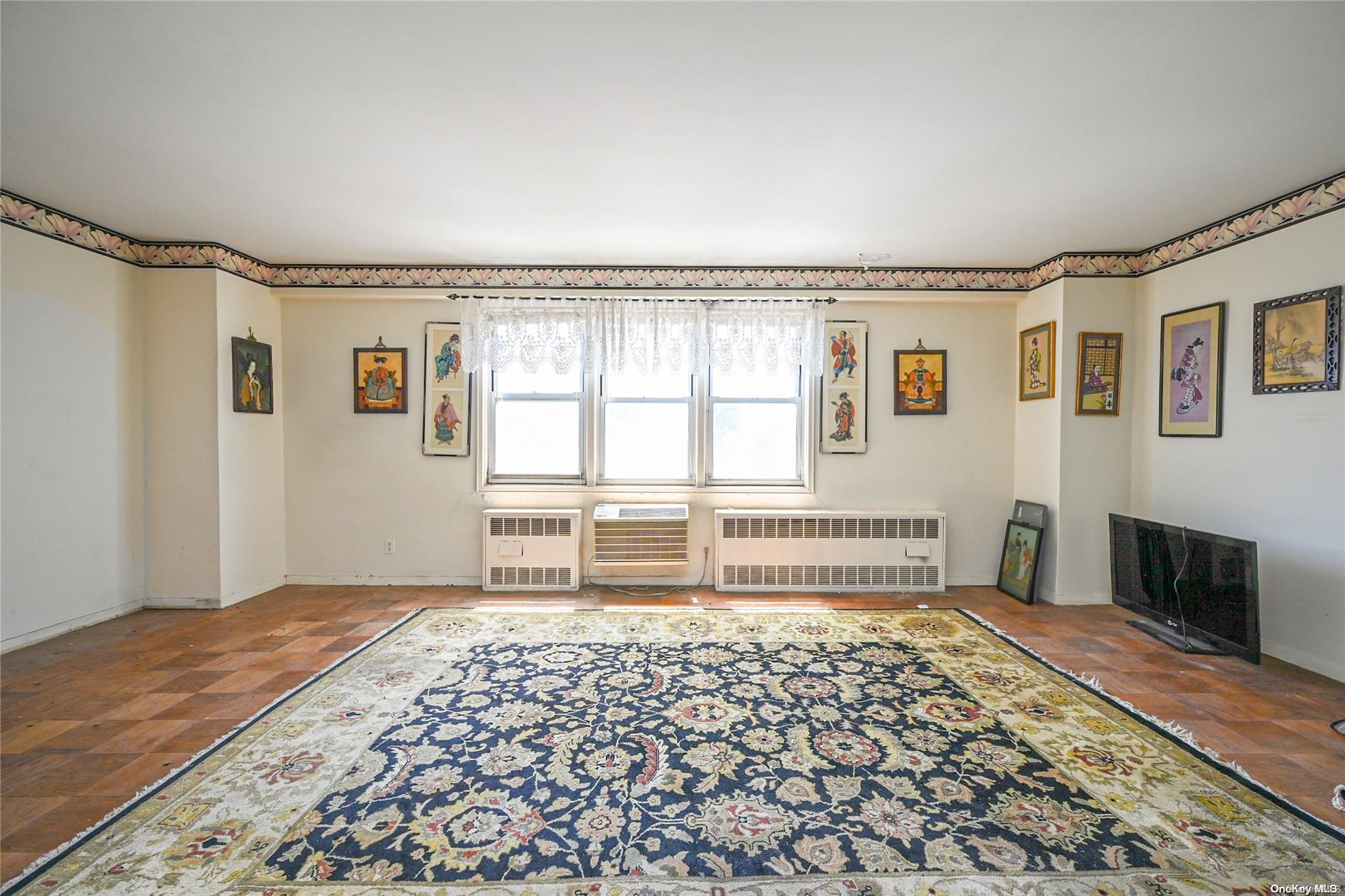 a bedroom with furniture and windows