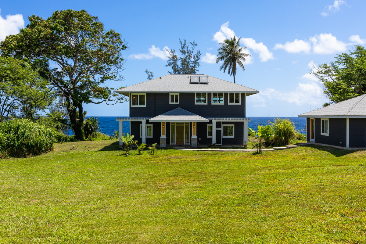 a front view of a house with swimming pool