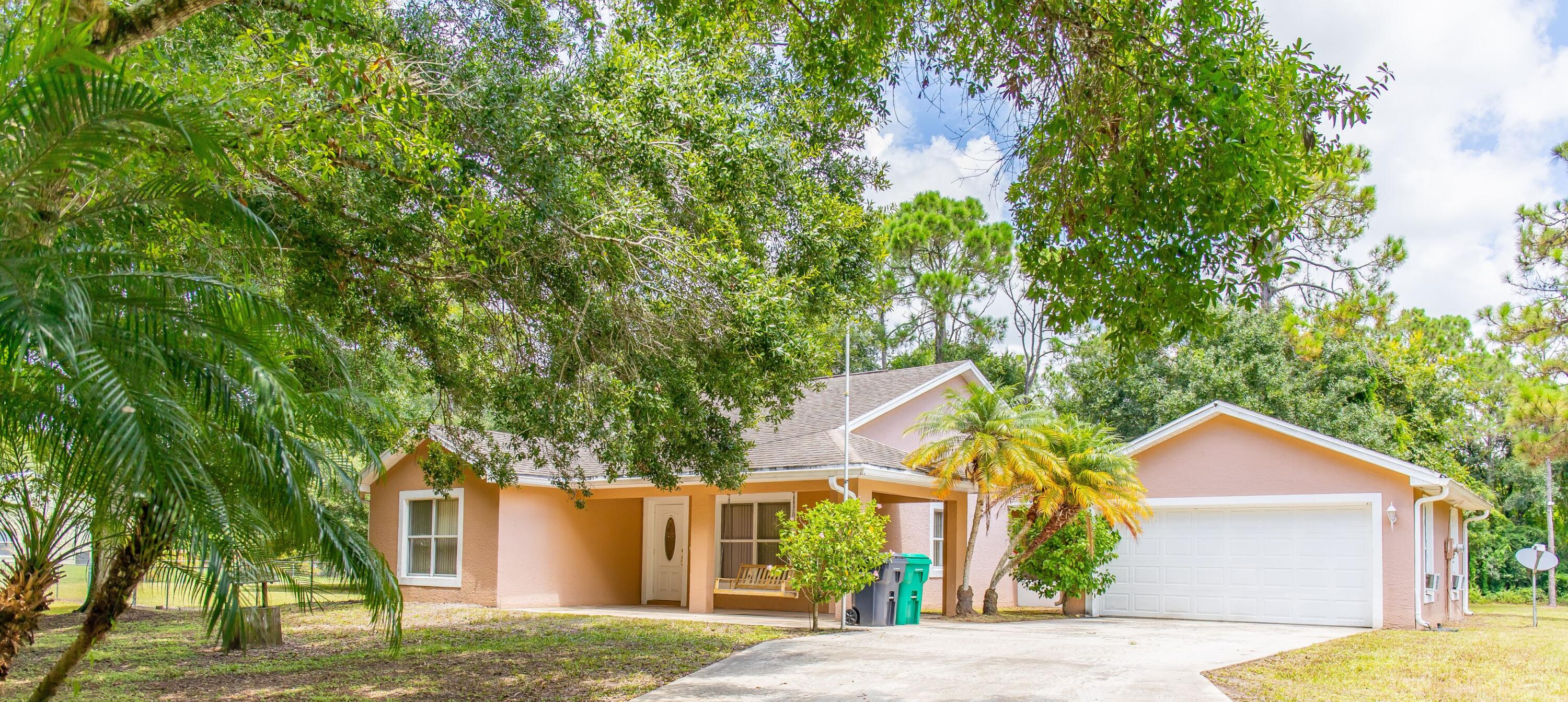 front view of a house with a tree