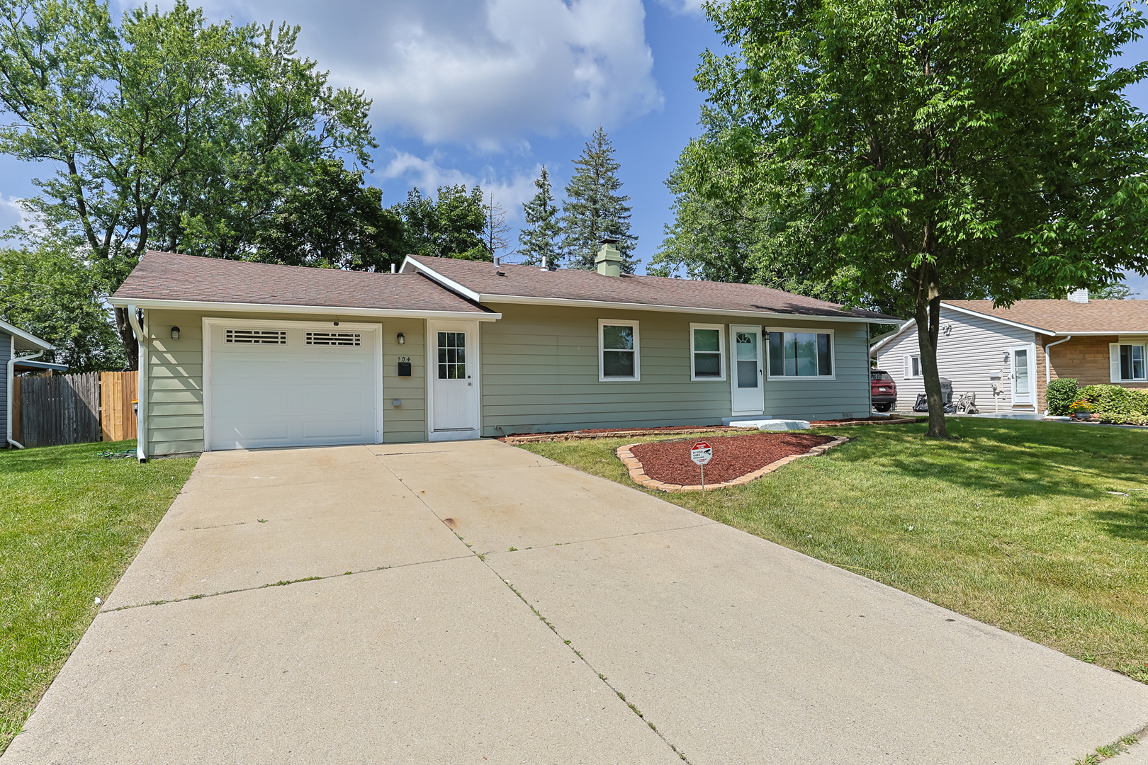 front view of a house with a yard