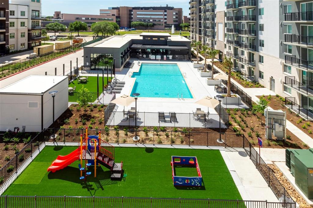 a view of swimming pool with seating area and car parked