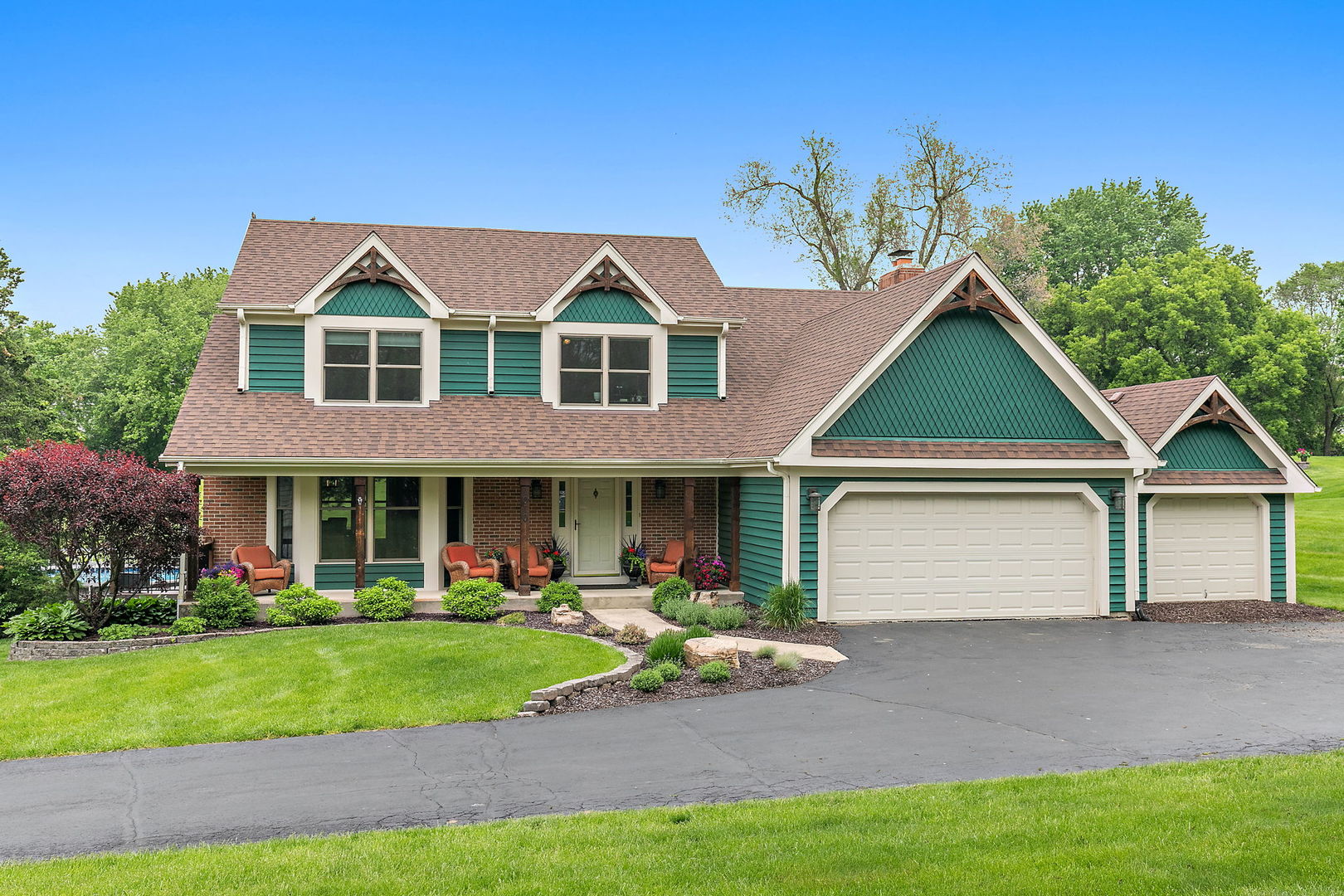 a front view of house with yard and green space