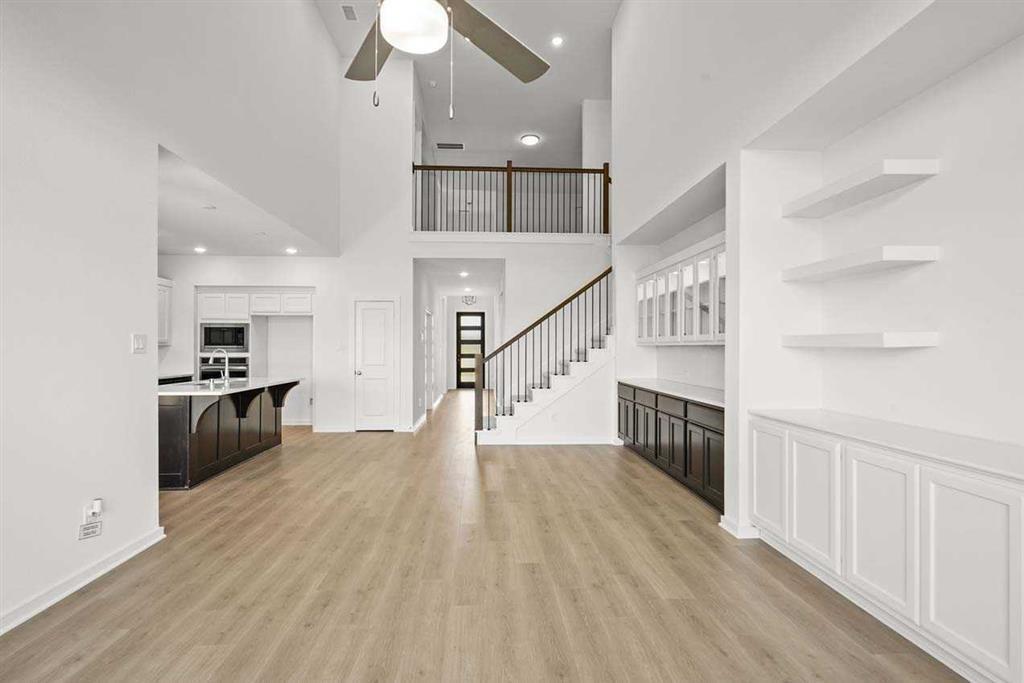 a view of kitchen with furniture and wooden floor