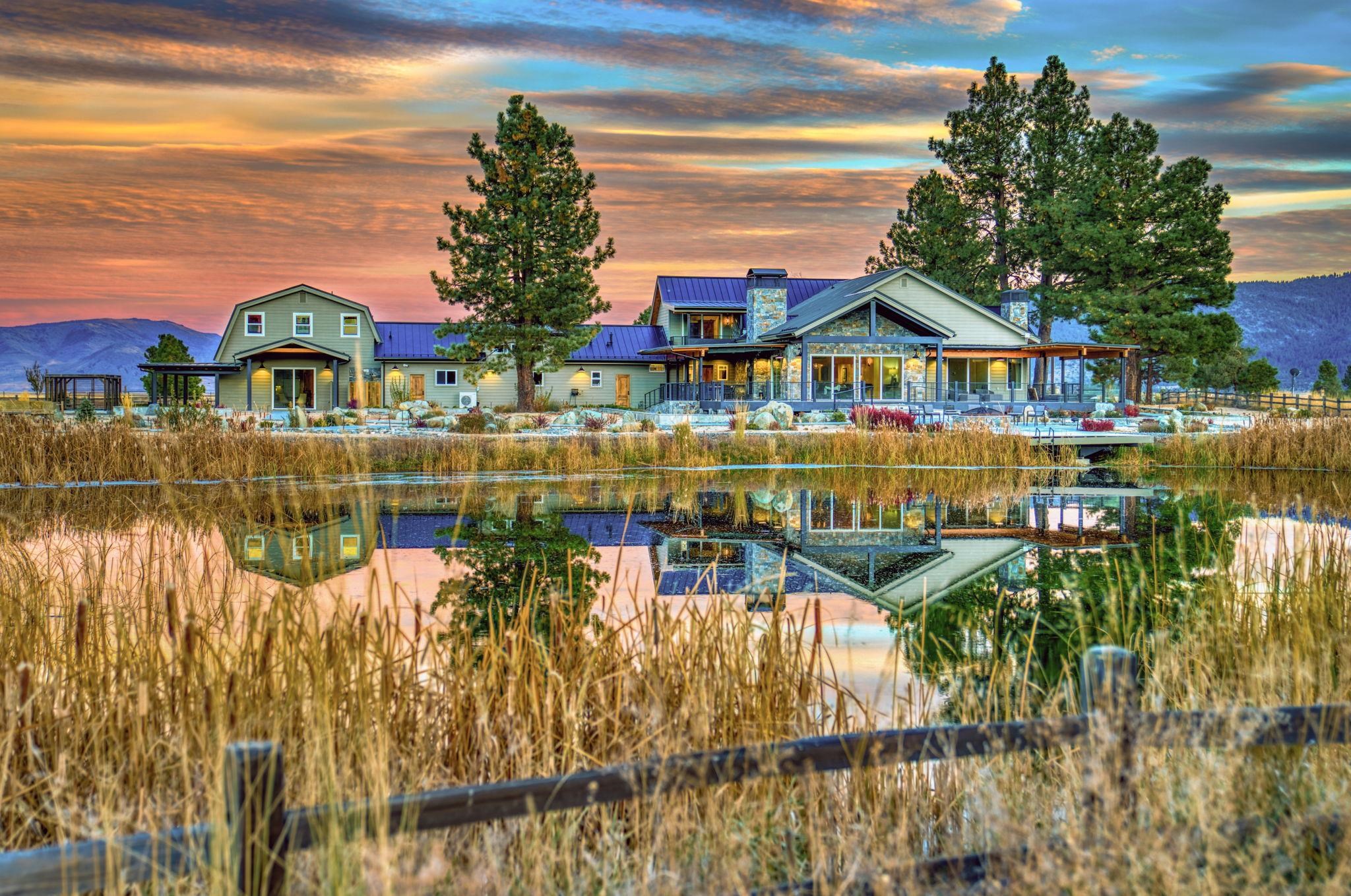 a view of a lake with a house in the background