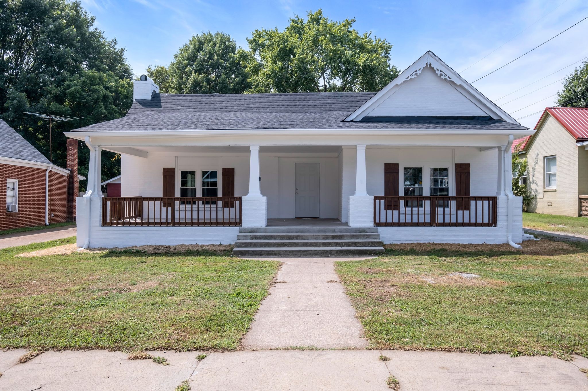 a view of a house with swimming pool and porch