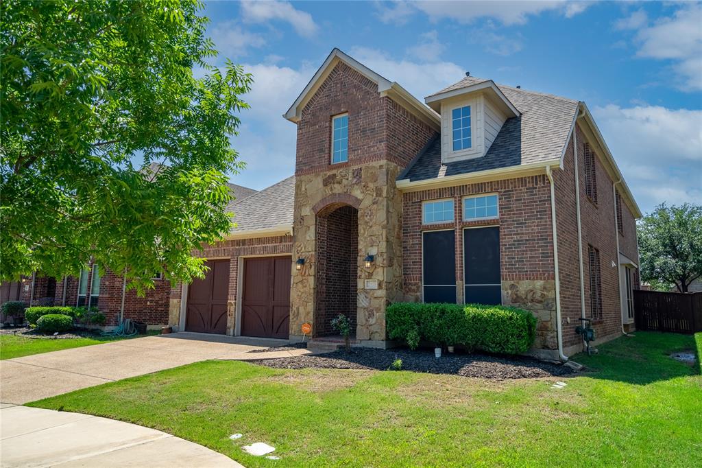 front view of a house with a yard