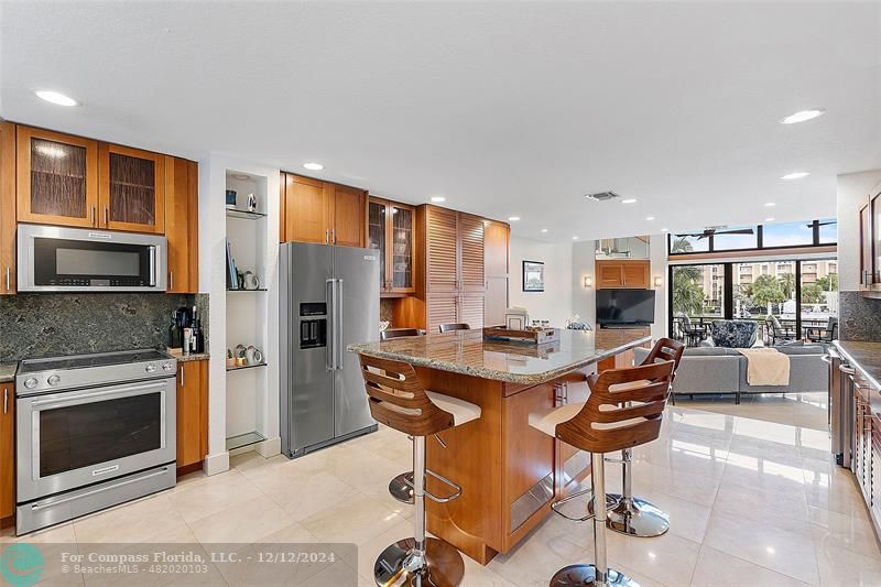 a view of a kitchen with dining table and chairs