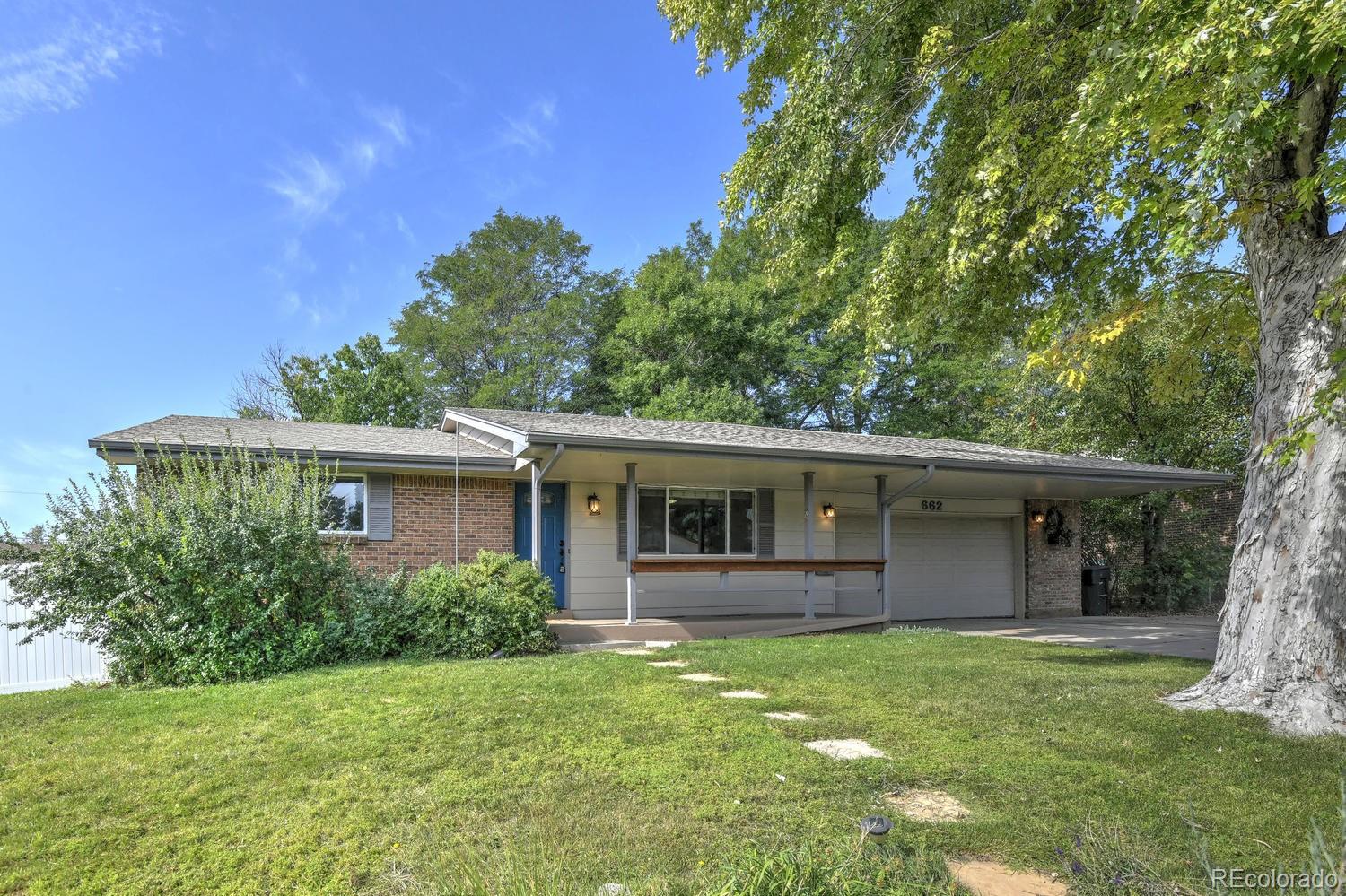 a view of a house with backyard porch and garden