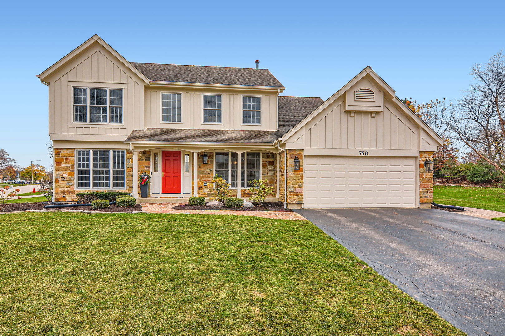 front view of a house with a yard